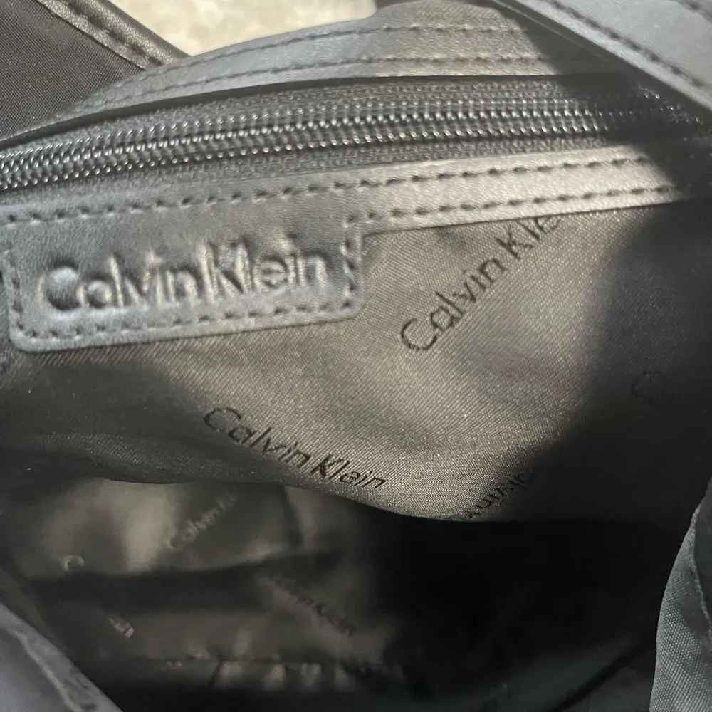 Calvin Klein Black Nylon large shoulder bag with gold tone hardwares.